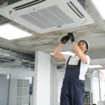 electrician-repairing-air-conditioner-indoors.jpg